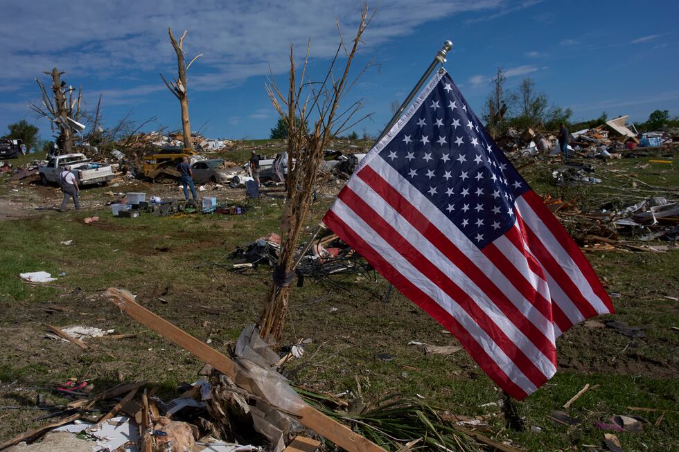An American Flag is posted near destroyed homes, Sunday, May 18, 2025, in London, Ky., after a...