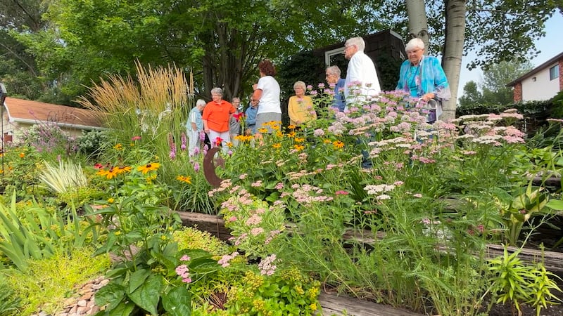 Touchmark residents got a special tour of Paula Redmann’s backyard garden