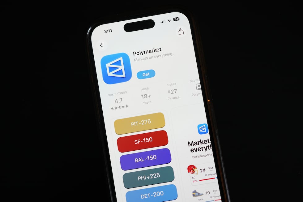 The prediction market app Polymarket is displayed on a mobile phone Thursday, April 16, 2026,...