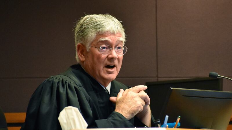 FILE - Montana District Judge Michael Moses speaks to attorneys during a court hearing on Sept...