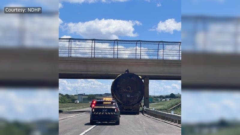 Oversized load stuck under overpass in Dickinson
