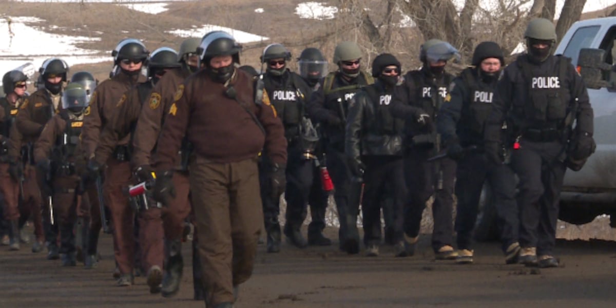 Dapl Protest Fenced Law enforcement moves in to remove remaining demonstrators from main ...