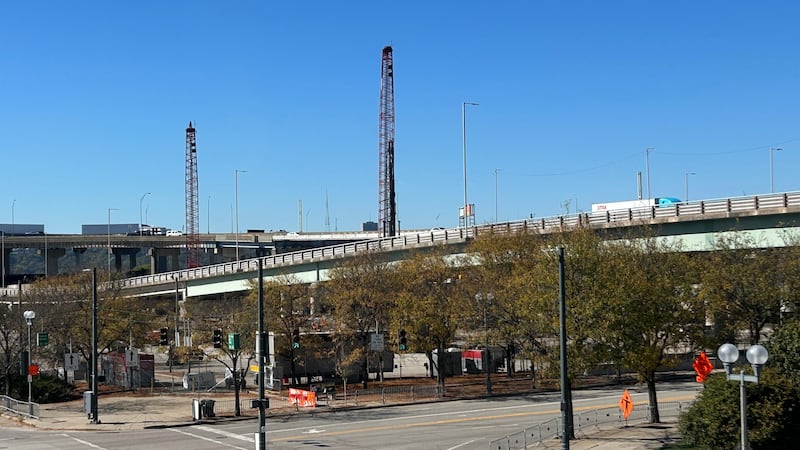 The man was operating the crane near West Third Street and Pete Rose Way when police say it fell.