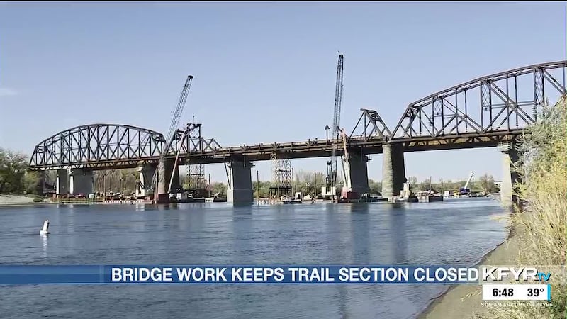 A section of Bismarck’s riverfront trail beneath the old BNSF railroad bridge will remain...